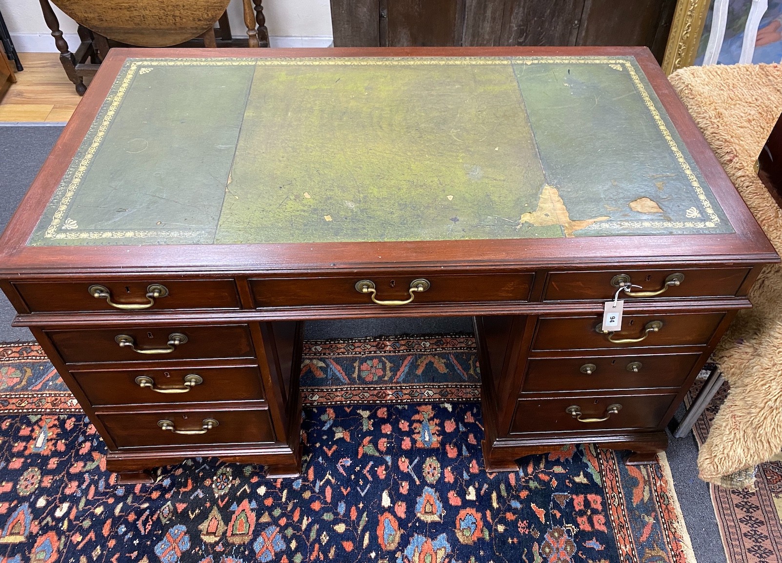 A George III style mahogany pedestal desk, width 140cm, depth 78cm, height 80cm